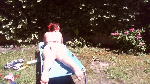 Nicoletta wears a large diaper in a public garden