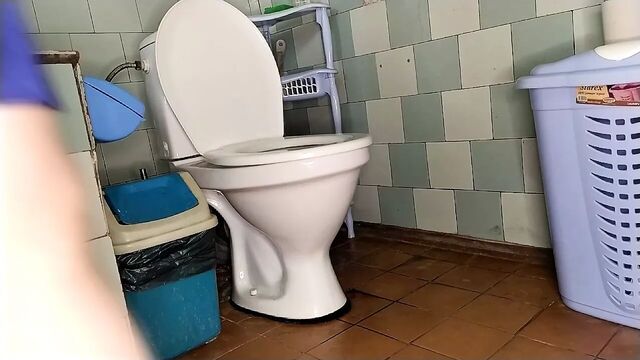 Chubby wife pissing on the toilet