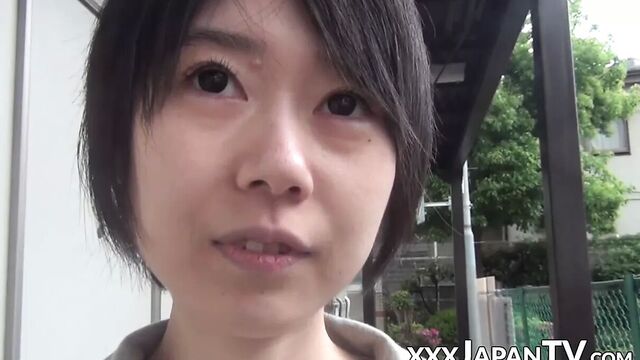 Young Japanese woman shows off butt and twat