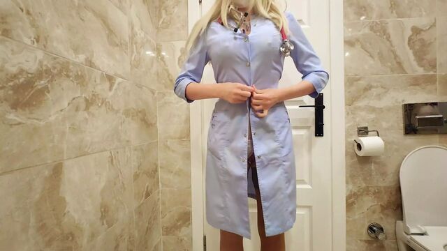 Nurse in the hospital toilet masturbates and makes a video on the phone for her subscribers